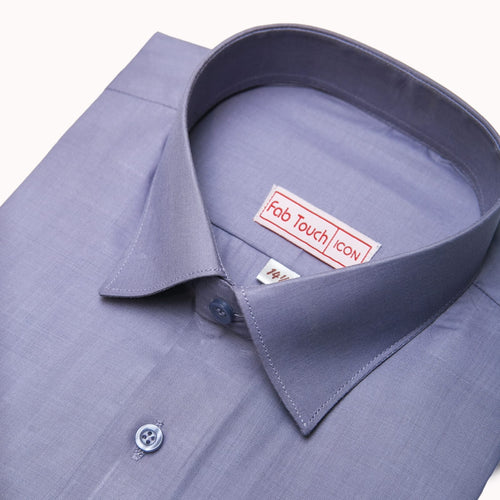 A close-up of a light blue-gray dress shirt collar with a visible Fab Touch Icon brand label inside the neck, set against a clean off-white background.