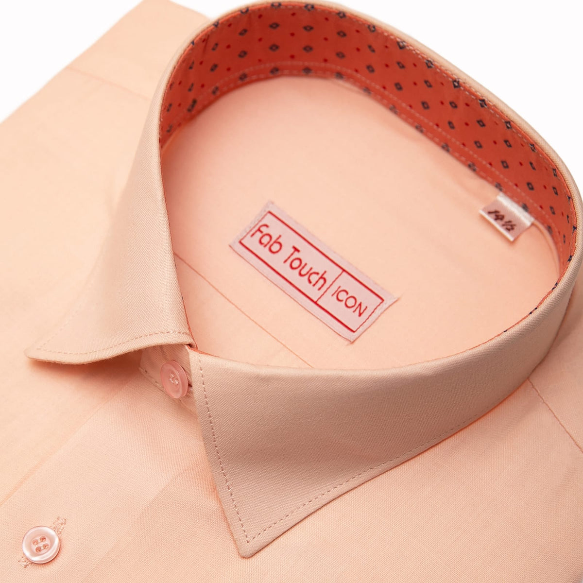 Close-up of a peach-colored dress shirt collar with a visible Fab Touch Icon brand label inside the neck, showing the inner lining pattern.